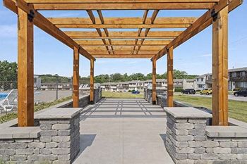 Outdoor kitchen with pergola & grilling stations